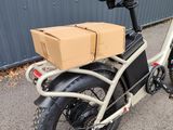 a bike that has a box on the back of it