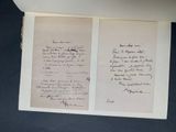 an open book with a handwritten poem on it sitting on a table