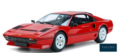 the red sports car is parked on a white surface