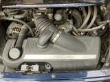 a close up of a car ' s engine with its hood open