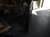 dimly lit room with a lamp and a mirror on the wall