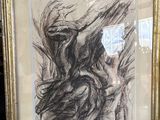 dessin encadré représentant une femme tenant un oiseau dans la main