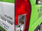 a green and white van parked on the side of the road