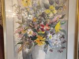 painting of a vase of flowers in a gold frame on a table