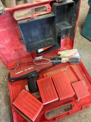 a red tool case with tools in it on the floor
