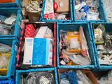 many boxes of assorted items sitting on the floor