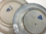two plates that are sitting next to each other on a table