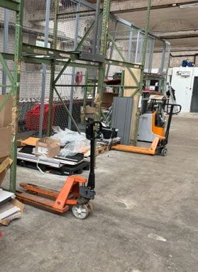 a forklift that is parked in a warehouse