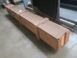 two wooden boxes sitting on the floor next to each other