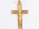 gold plated crucifix with a cross on a white background