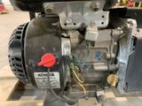 a close up of a small engine on a stand