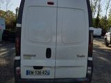 a white van that is parked in a parking lot