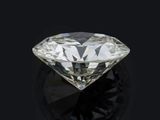 a close up of a diamond on a black surface