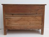 a wooden chest with a drawer on top of it