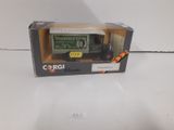 a box with a toy truck in it on a white surface