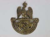 an image of a brass plate with an eagle on it