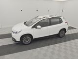 the white car is parked in the garage of the building