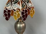 an image of a lamp with a stained glass shade on it