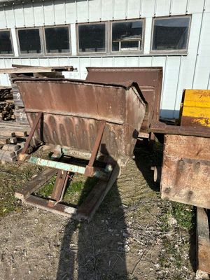 a pile of junk sitting in front of a building