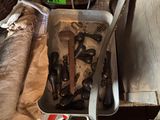 several pairs of shoes are sitting in a suitcase on the floor