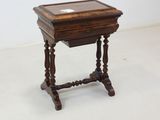a small wooden table with a glass top on a white floor
