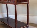 a wooden table with a marble top on it