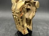brass statue of a horse with a saddle on a black base