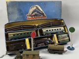 a box with a train set in it on a white surface