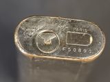 a close up of a metal object with a clock on it