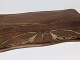 an image of a wooden box with a decorative design on it