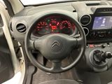 the interior of a small car with a steering wheel and dashboard lights
