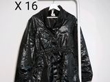 an image of a black jacket hanging on a white hanger