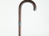 a close up of an umbrella with a wooden handle on a white background