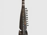 a close up of a musical instrument on a white surface