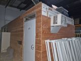 a picture of a room that has a lot of wood on the walls
