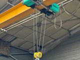 a crane that is hanging from the ceiling of a building