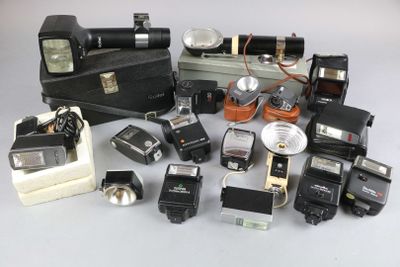 a lot of old cameras and other items on the table
