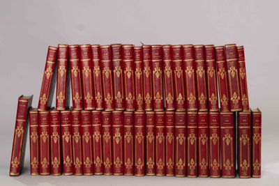 a lot of red books stacked on top of each other