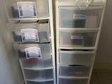 two plastic drawers that are sitting next to each other