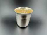 a silver cup that is sitting on a table