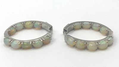 pair of white oplite hoop earrings with silver accents