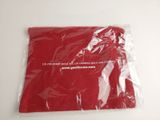 a bag of red tissue sitting on a table