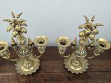 pair of antique brass candelabs with flowers and leaves
