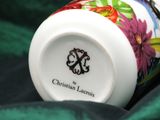 a coffee cup with a floral design on it