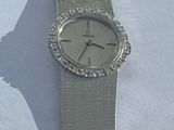 a watch that is sitting on a white table