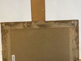 an old picture frame sitting on top of a wooden shelf