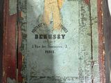 an old book with a picture of a woman on it