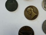 a lot of coins that are on the table