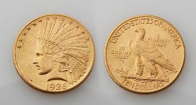 two indian gold coins, one of which is a head and one of which is an eagle