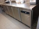 a stainless steel counter top with a microwave on it